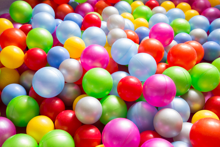 Multicolored plastic balls from pull at children playground.Closeup.の写真素材