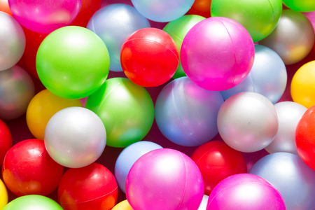 Multicolored plastic balls from pull at children playground.Closeup.の写真素材