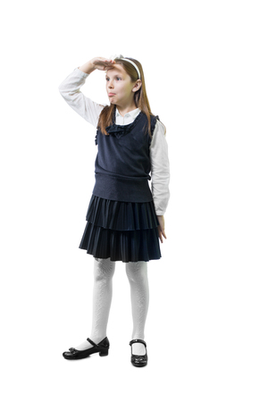 Schoolgirl in uniform against white background.の写真素材