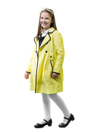 Schoolgirl in uniform against white background.の写真素材