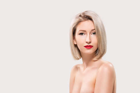 Portrait of beautiful female model on grey backgroundの写真素材