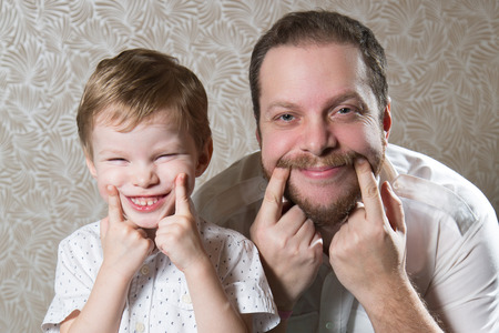 Portrait of caucasian man with his little sonの写真素材