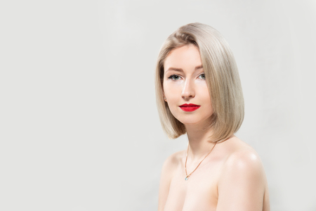 Portrait of beautiful female model on grey backgroundの写真素材