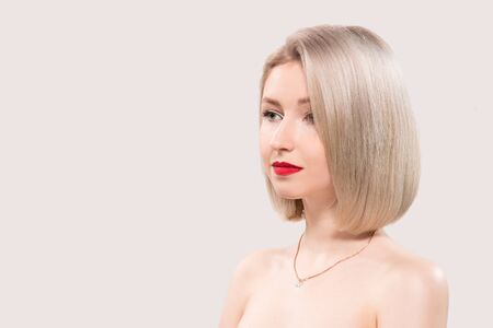 Portrait of beautiful female model on grey backgroundの写真素材