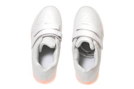 White sneackers with led light sole. Isolated over white background.の写真素材