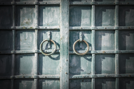 Ancient forged door with a rings Horizontalの写真素材