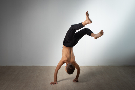 modern style dancer posing on studio backgroundの写真素材