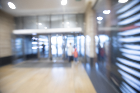 Abstract blurred image of shopping mall and people for background usageの写真素材