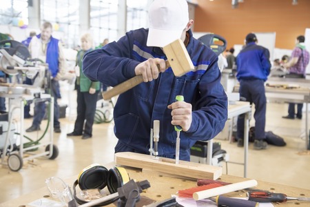 A man works in a carpentry shop. Selective focusの写真素材