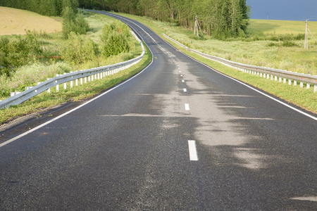 wet asphalt road after a rainの写真素材