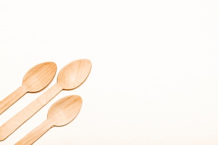 Wooden spoon Eco-friendly disposable utensils made of bamboo wood and paperの写真素材