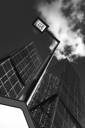 Urban landscape with street lamp and skyscrapers.の写真素材