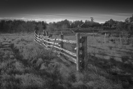 view of the Russian countryside with broken fenceの写真素材