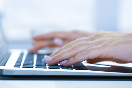 woman using laptop, searching web, browsing information, having workplace at home soft focus picture Vintage conceptの写真素材