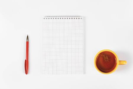 Blank diary, pen, cup of coffee on white table, mock upの写真素材