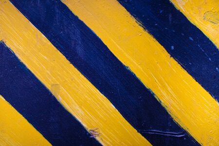 Safety stripes on construction site, Black and yellow Under construction sign over a grunge textureの写真素材