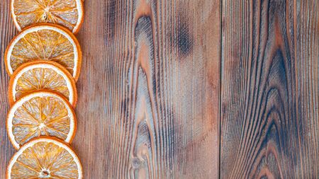 dried oranges on wooden backgroundの写真素材