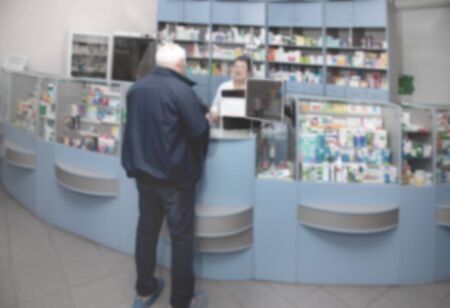 Blur abstract background drugstore with customer. Defocus white drugstore with pharmacist.の写真素材