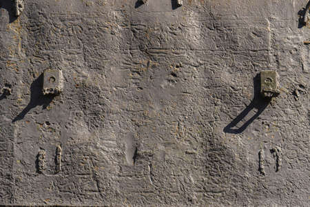 Detail of an old surface with exfoliated paint and rivets on military equipment. Military background. High quality photoの写真素材