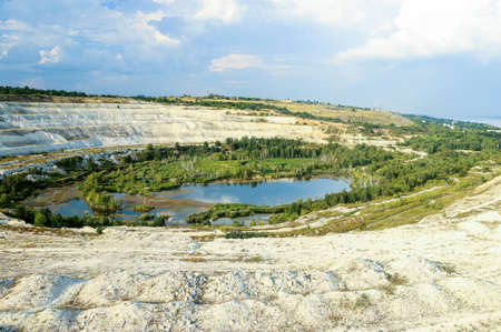 Old open-cast mine. Industrial extraction of chalk and by mining. Lake in quarry