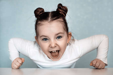 Portrait of emotional little girl at home. High quality photoの写真素材