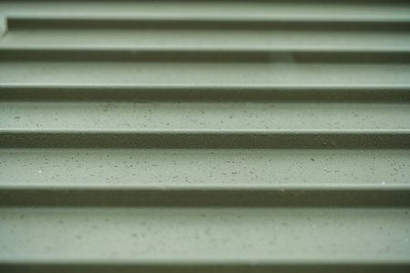 Abstract green industrial metal background texture with bolts and rivets. High quality photoの写真素材