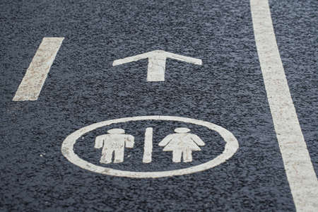 Figure pointing to the location of the toilet. High quality photo