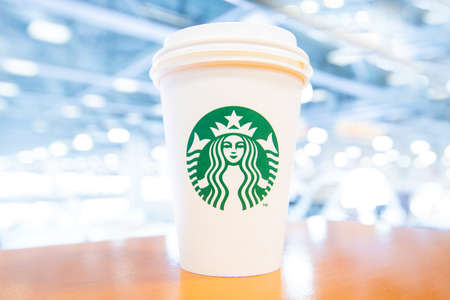 Moscow, Russia - March 30, 2021: Coffee with you. A cup of Starbucks coffee on the table. High...