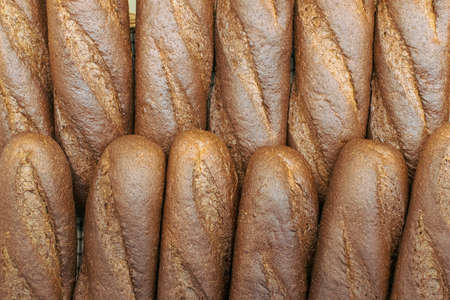 Bakery - gold rustic crusty loaves of bread and buns. High quality photoの写真素材