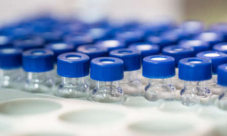 Coronavirus vaccine: covid-19 bottle vaccination. Coronavirus vaccine: covid-19 vaccine bottle vaccination and syringe to inject the vaccine. Vaccination concept. Selected focusの写真素材
