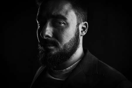 Portrait of a brutal young man with a beard. High quality photoの写真素材