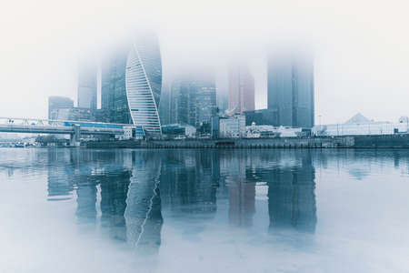 Moscow, Russia - November 29, 20209: Heights in the fog. Buildings of the business center Moscow City in a cityscape. High quality photoのeditorial素材