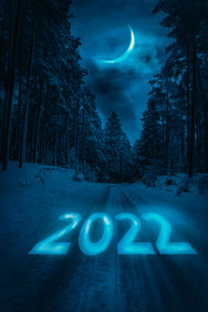 New year 2022 or straightforward concept. Text 2022 written on the road in the middle of road at...
