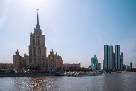 MOSCOW, RUSSIA - APRIL 18, 2022: Landscape of the Moskva River with a high-rise hotel Ukraine and...