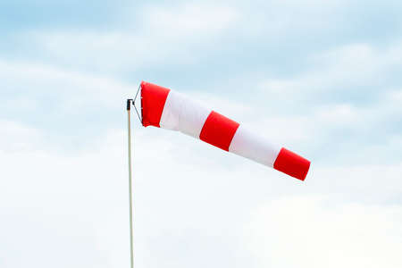 Windsock indicator of wind on runway airport. High quality photoの写真素材