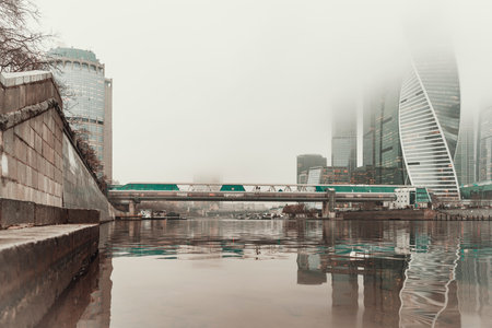 The view of the Moscow City buildings and bridge from the Taras Shevchenko embankment. Photo was taken in sunny winter day. . High quality photoの写真素材