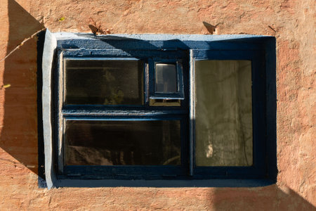 Old wooden window with blue frame in old building. High quality photoの写真素材