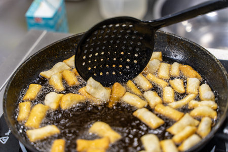 The dough is fried in pieces in a pan in oil (Pa Thong Ko), Baursaks or chak chak is a traditional...