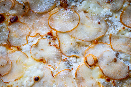 Pizza with pear and garaganzola cheese and mozzarella close-up. Background. High quality photoの写真素材