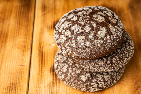 Buns or bread made of rye flour on a wooden background. Space for text. Copyspace. High quality...