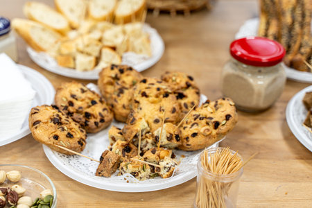 Chocolate and nut cookies on the table and toothpicks for tasting. High quality photo