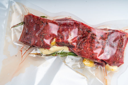 Beef Vacuumed with Rosemary cooked sous vide on a white background. High quality photoの写真素材