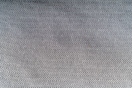 Gray linen or cotton fabric close-up. Fabric textured background. High quality photo