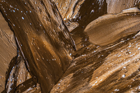 Abstract background with brown and beige plaster texture. Seamless background with large brushstrokes. Rough stylized texture with space for text. High quality photoの写真素材