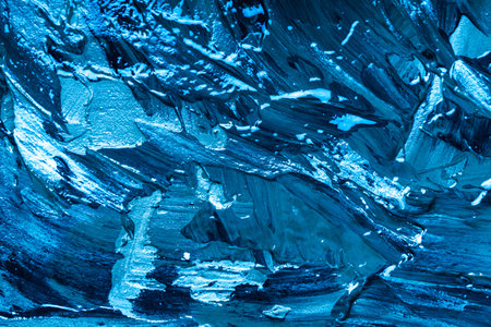 Abstract background with the texture of plaster or oil paint in rich blue color. Seamless background with large brush strokes. Rough stylized texture with space for text. High quality photoの写真素材