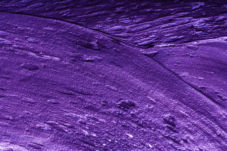 Abstract background with purple plaster texture. Seamless background with large brush strokes. Rough stylized texture with space for text. High quality photoの写真素材
