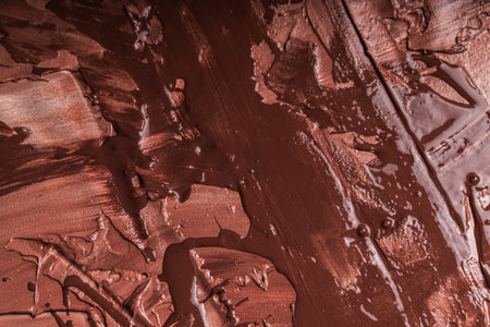 Abstract background with brown or chocolate colored plaster texture. Seamless background with large brush strokes. Rough stylized texture with space for text. High quality photoの写真素材