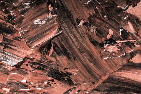 Abstract background with brown or chocolate colored plaster texture. Seamless background with large brush strokes. Rough stylized texture with space for text. High quality photoの写真素材