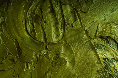 Abstract background with green plaster texture. Seamless background with large brush strokes. Rough stylized texture with space for text. High quality photoの写真素材