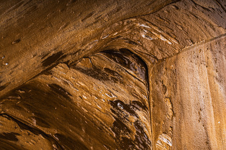Abstract background with brown and beige plaster texture. Seamless background with large brushstrokes. Rough stylized texture with space for text. High quality photoの写真素材
